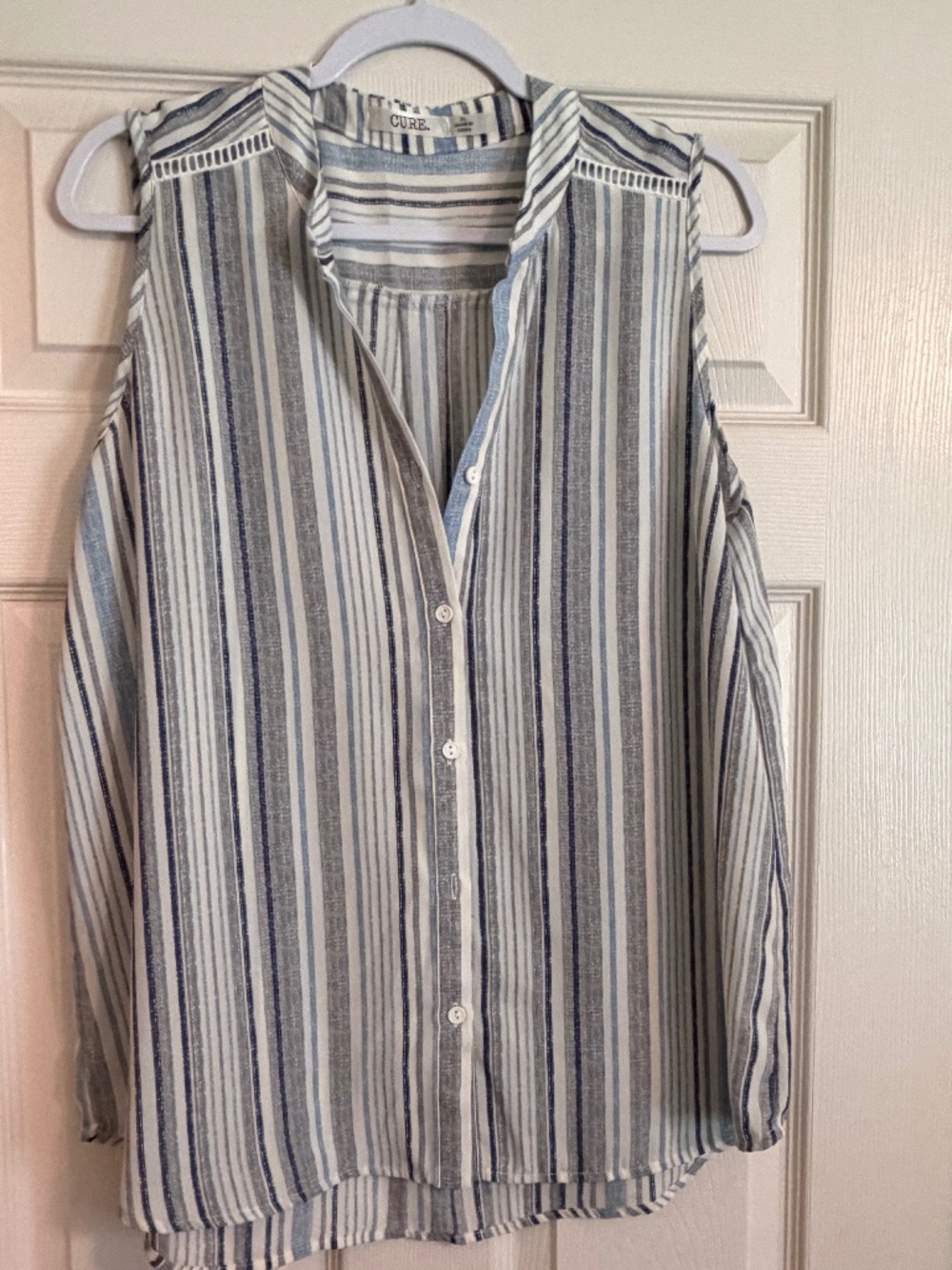 Sleeveless button down blouse